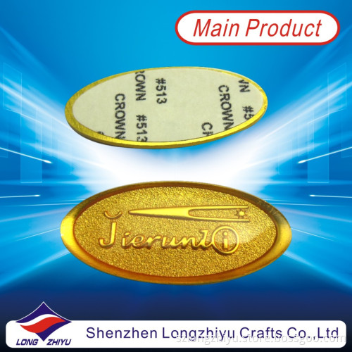 Fashion New Custom Embossed Logo Gold Sticker, Metallized Sticker Nameplate Epoxy Emblem with Self Adhesive Label (LZY600010)